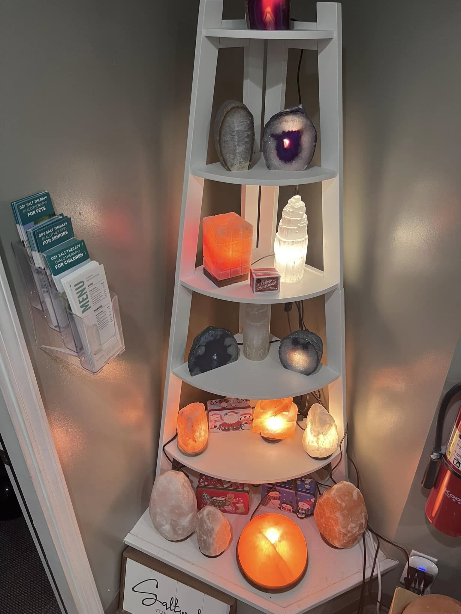 Sweet Dreams Salt Therapy retail display with Himalayan salt lamps and crystals